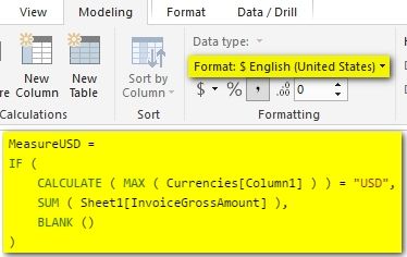 Showing metric and corresponding currency based on slicer selection_1.jpg